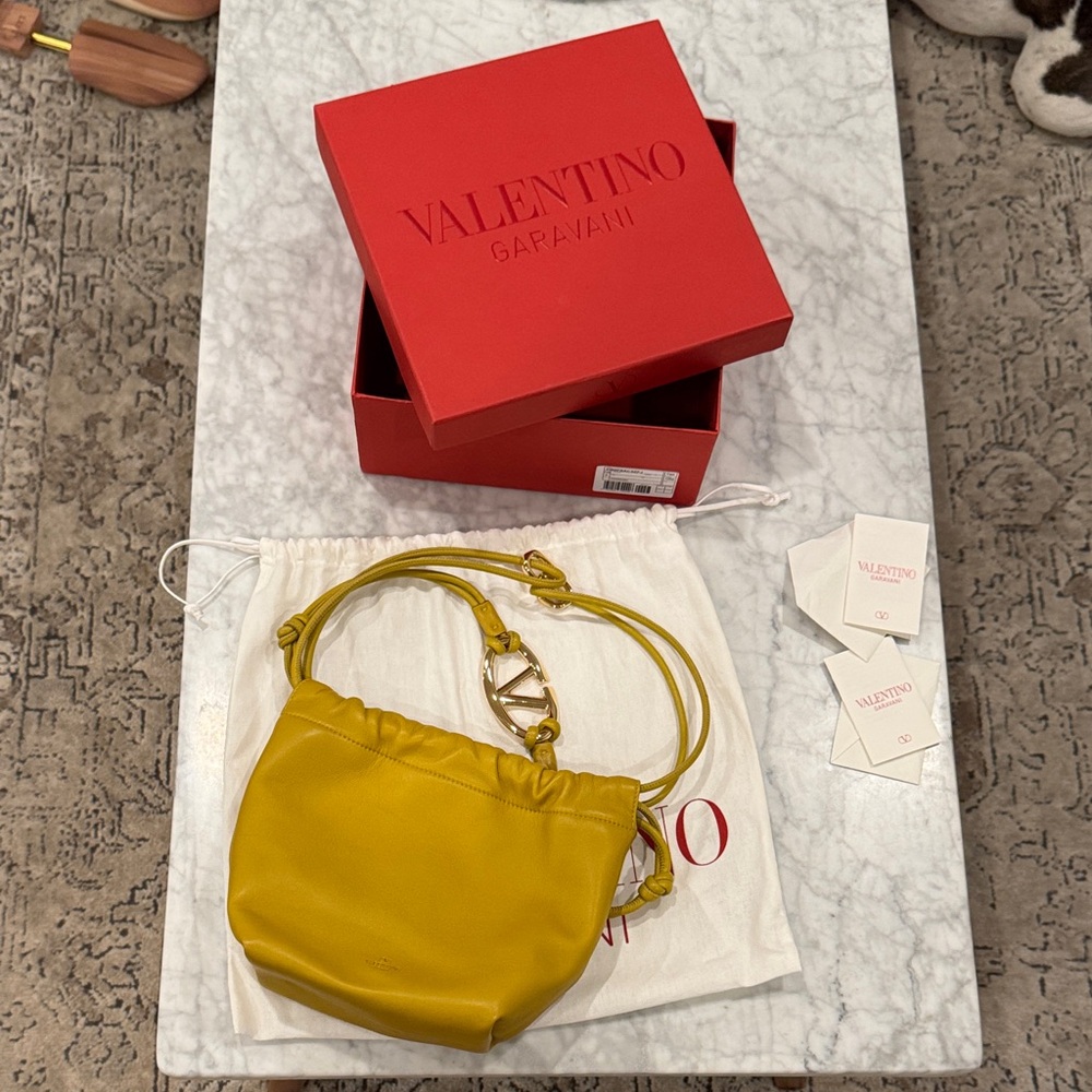 Valentino Garavani Mustard Mini Vlogo pouf bucket crossbody bag purse drawstring